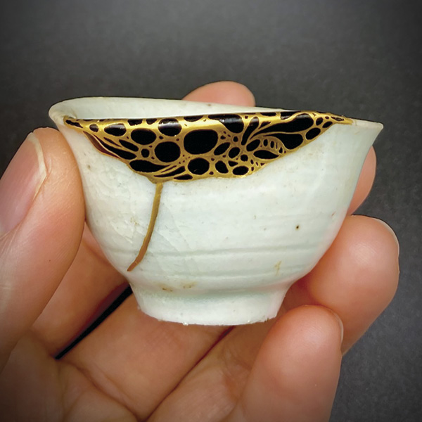 6 Born This Way – Ikigai – Reason for Being, 2 in. (5 cm) in diameter, early Imari porcelain cup, repaired with resin, urushi, 231/2K gold, decorated with maki-e, 2024.
