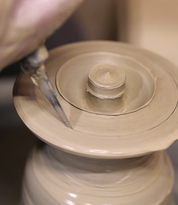 6 Pull out the rim of the lid and shape the finial. Use a wire tool to cut the diameter to match the gallery diameter.