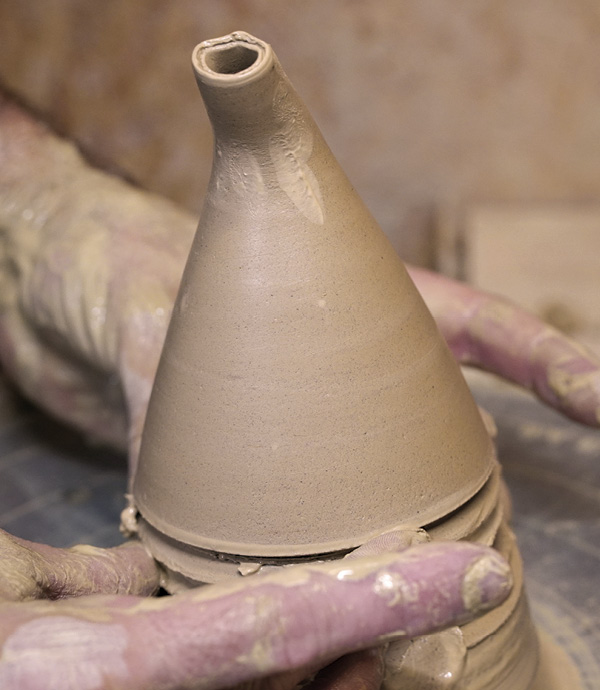 7 Throw the spout into a funnel shape and cut off the hump.