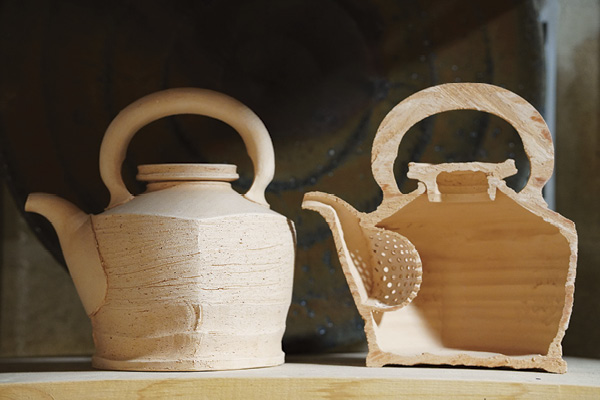 Cross-sectioned kettle form.