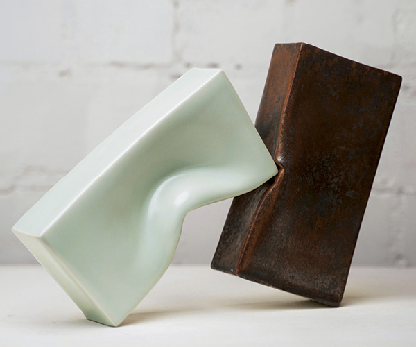 2 Duett, 8⅝ in. (22 cm) in length (each brick), slip-cast and altered porcelain, tea-dust glaze, individually fired in a gas kiln, balanced for installation, 2022. Photo: Sebastian Weindel.