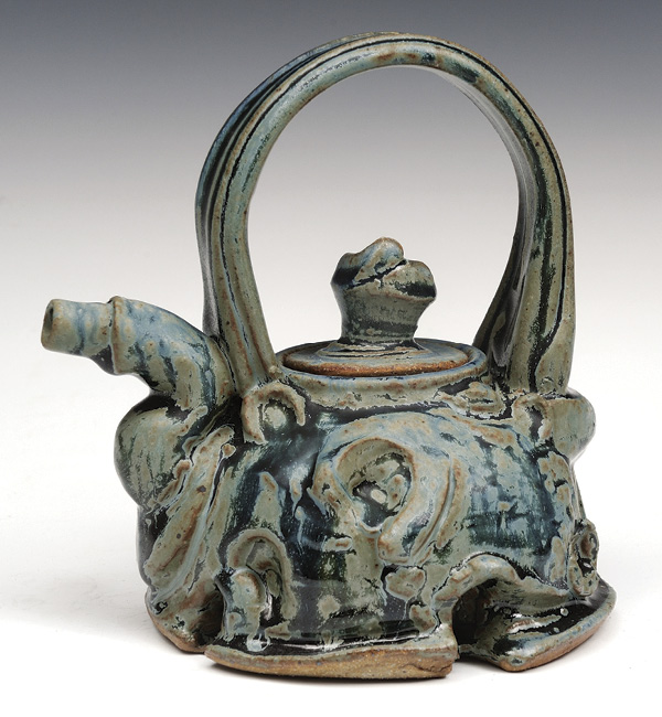 1 Brian Grow’s Blue Deconstructed Teapot, 9 in. (23 cm) in height, wheel-thrown and altered soda-fired stoneware, 2021.