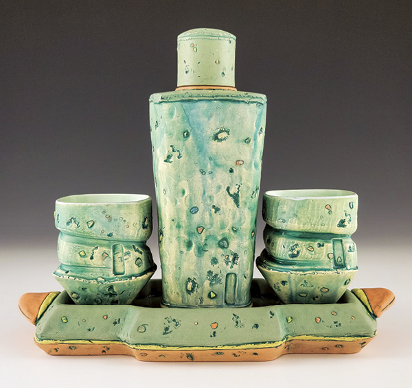 1 Samantha Momeyer’s whiskey set, 12 in. (30 cm) in length, thrown-and-altered stained porcelain, colored porcelain inclusions, Amaco underglaze wash, fired to cone 5 in oxidation, 2023. Photo: Companion Gallery