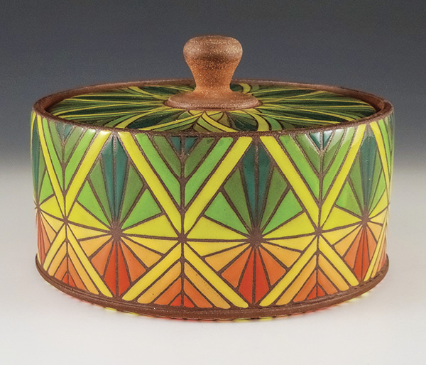 1 Chris Hosbach’s Sunburst Pattern Lidded Jar, 8½ in. (22 cm) in diameter, red stoneware, fired to cone 6 in oxidation, 2023. Photo: Companion Gallery.