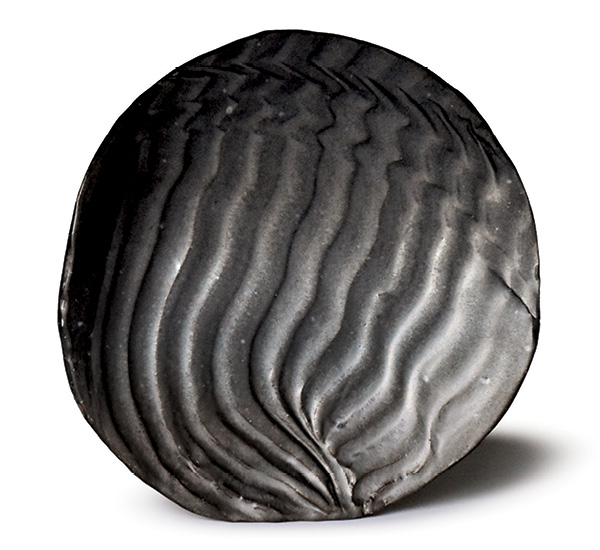 5 Platter, 19 in. (48 cm) in diameter, handbuilt stoneware, cut-wire design, matte-black glaze, fired to cone 10 in reduction.