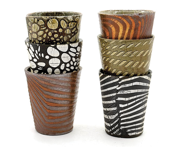 5 Yael Braha's Tumblers, 4 in. (10 cm) in height, stoneware, slip, ash glaze, fired to cones 6 and 10 in various kiln types (gas, wood, electric), 2023.