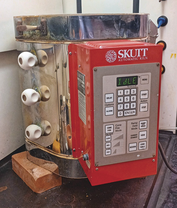 The Skutt KM-614, closed, with two layers of shelving for pots.