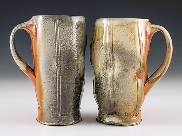 1 Ben Eberle’s Tall Dimpled Mugs, to 6 1/4 in. (15.9 cm) in height, wood- and soda-fired B-mix 10 clay, slip, glaze, 2024. Photo: Companion Gallery.