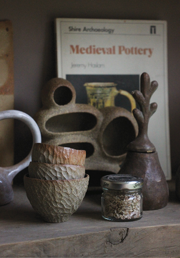 2 A shelf of vessels and a Nest sculpture in the artist’s studio.