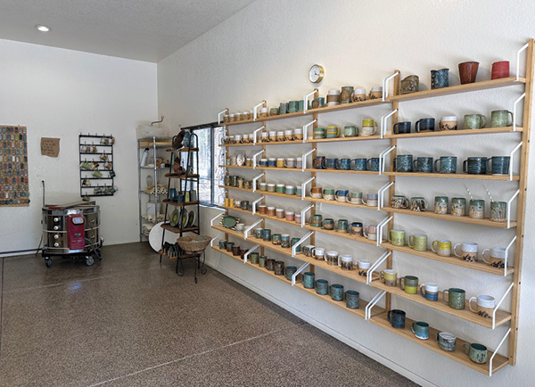 The gallery zone features shelves of finished work for shoppers and serves as inspiration while making work.