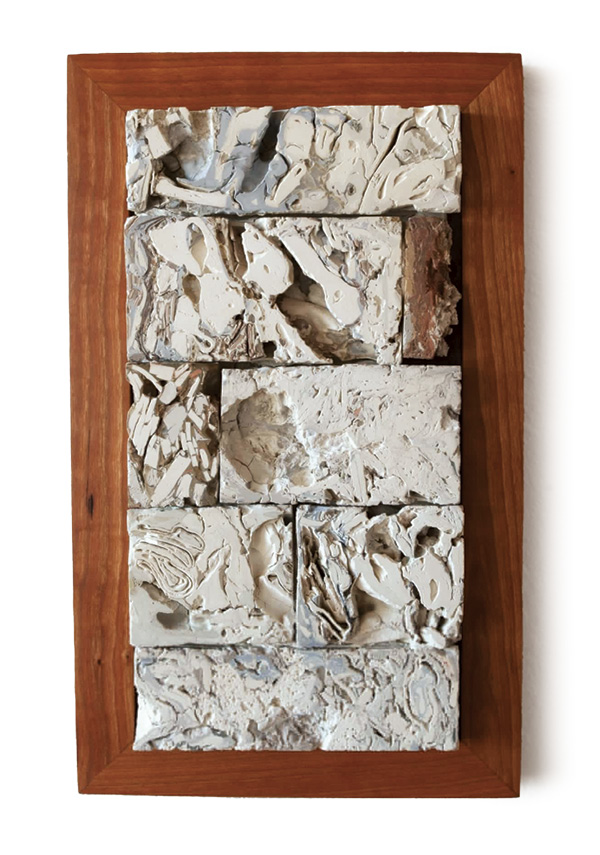 1 Lauren Mayer’s All Possible Definitions of the Past, 20 in. (50.8 cm) in height, colored porcelain, glaze, material castoffs from in-progress work, fired in oxidation to cone 10, cherry frame, 2022.