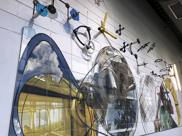 3 Brian Boldon's From Idea to Practice, 23 ft. (7 m) in width, printed ceramic pigments, tile, 3D-printed porcelain, fired to various temperatures, glaze, kiln-formed glass, painted steel, stainless steel, 3D-printed carbon fiber, 2021. Photo: Amy Baur.