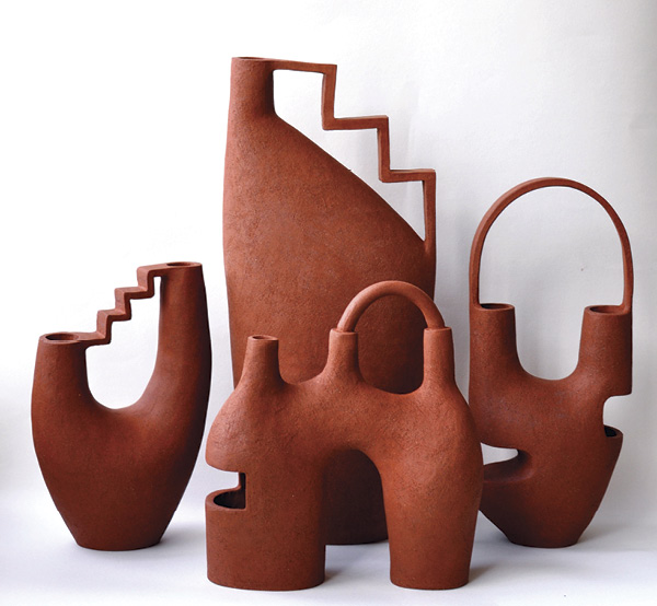 4 Janice Cormier's The Space Between, a collection of vessels featuring arches and stairs details.