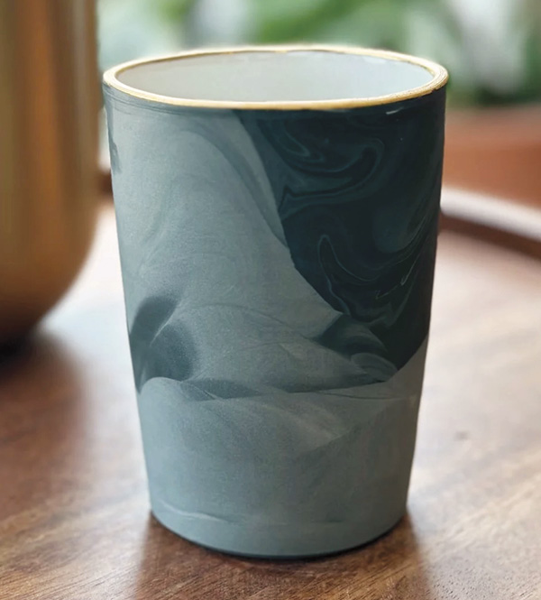 1 Abbie Preston Edmonson and Jessica Gutierrez’s Marbled Cup with Gold Rim, 41/2 in. (11.4 cm) in height, Green Casting Slip, porcelain slip, luster, fired to cone 6, 2023.