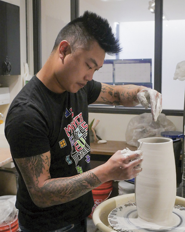 Jason Wang throwing a pitcher. Photo: Christopher Erazo. Lawrence Arts Center, Lawrence, Kansas.