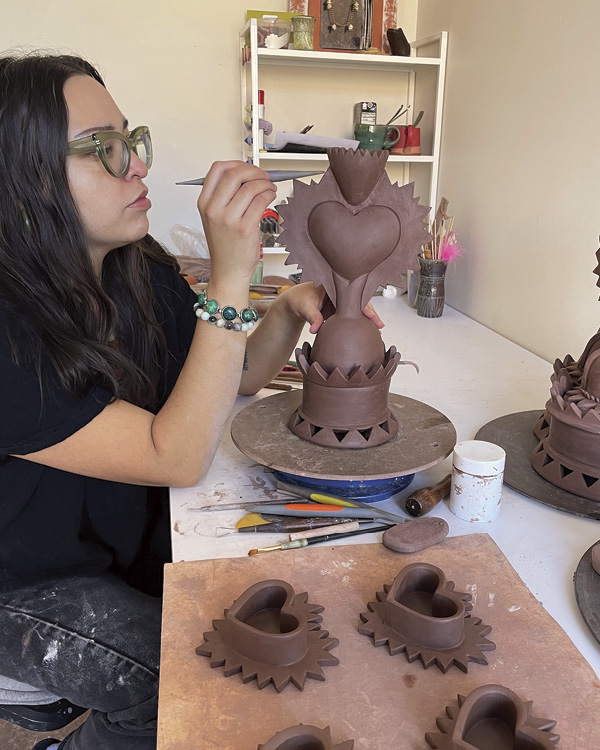 Resident artist, Angela Rangel, refining a sculpture in progress. 323CLAY, Independence, Missouri.