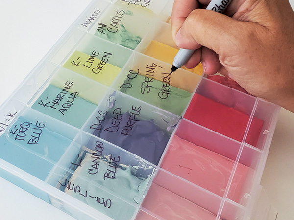 2 Using a permanent marker, label each underglaze and note the brand for future reference.