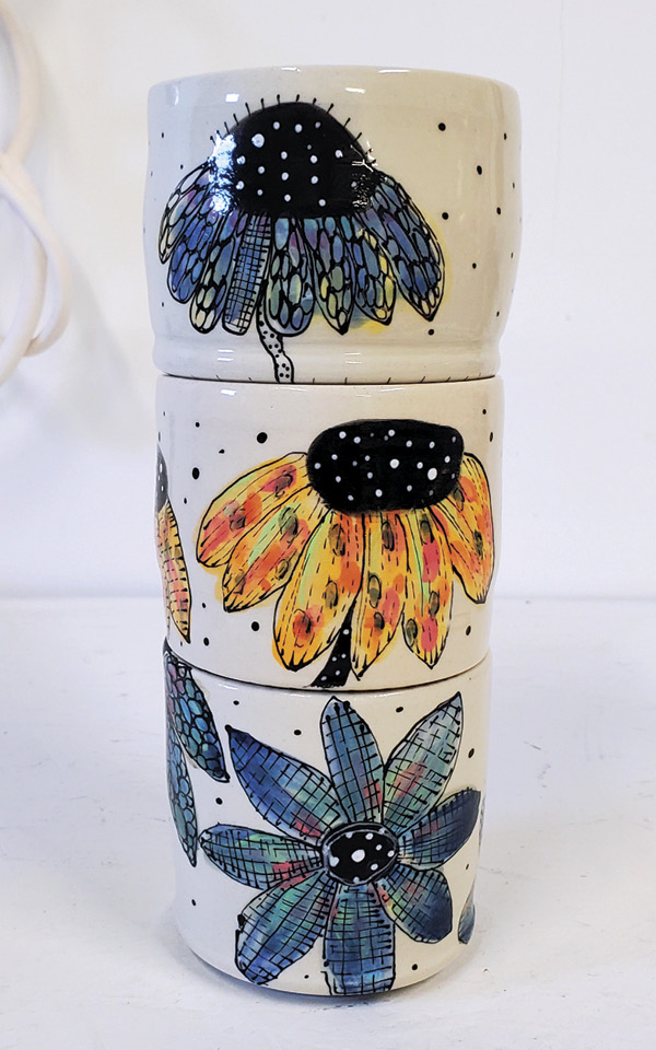 8 Stack of cups with layered underglaze decoration.
