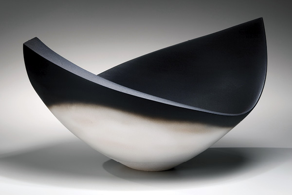 2 Shibuya Eiichi’s graduated black and white form, 23 in. (58.4 cm) in length, stoneware, glaze, 2023. Photo: Richard Goodbody. Courtesy of Joan B Mirviss LTD.