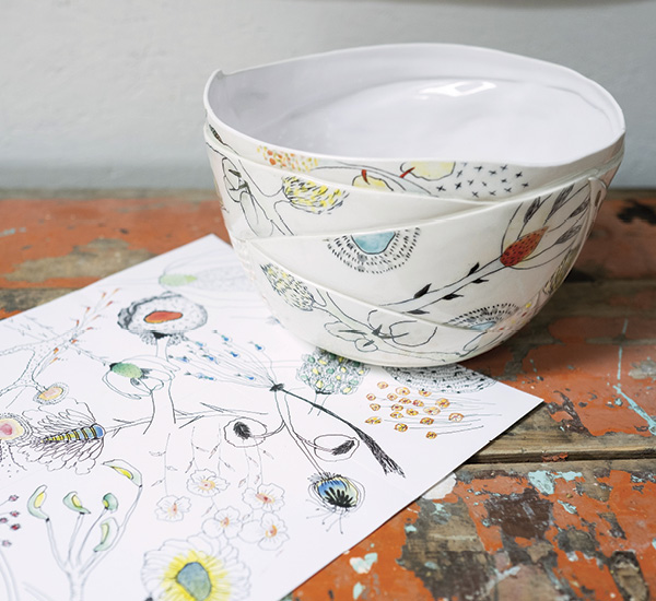 Marney McDiarmid's finished bowl, sitting next to a sketch of matching artwork.