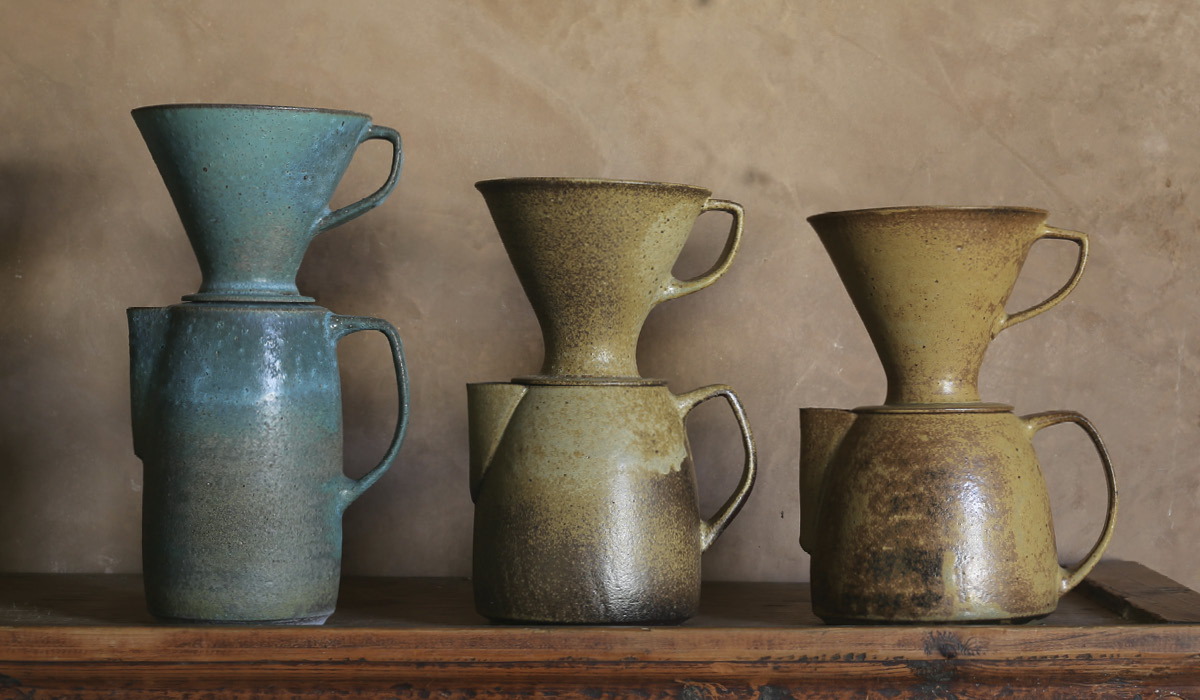 3 Coffee pour overs, to 10 in. (25 cm) in height, local wild clay, commercial-material glaze (left), and local wild glazes (center and right), 2023.