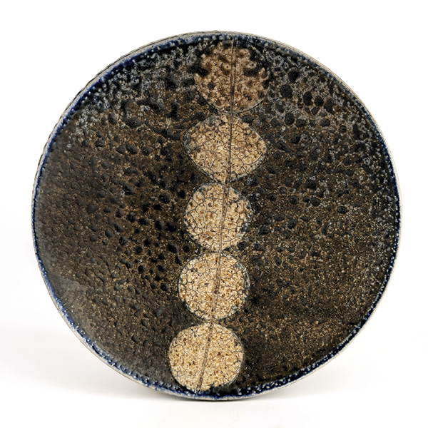 11 Dinner plate, 9 in. (23 cm) in diameter, wheel-thrown stoneware with sand, black slip, white slip, salt, soda, and wood fired, 2023. All photos: Howard Korn.