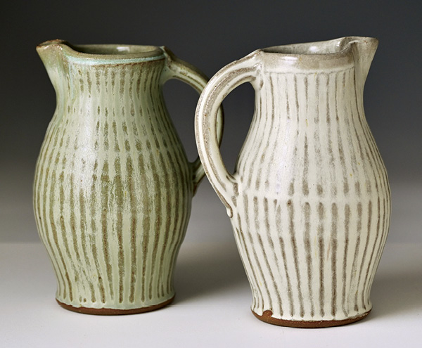 2 Lucy Fagella's Pouring pitchers, wheel-thrown and carved stoneware, glaze, fired and slow cooled in oxidation to cone 6.