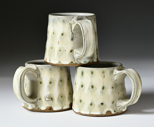 3 Lucy Fagella's Stacked mugs, wheel-thrown stoneware, glaze, fired and slow cooled in oxidation to cone 6.
