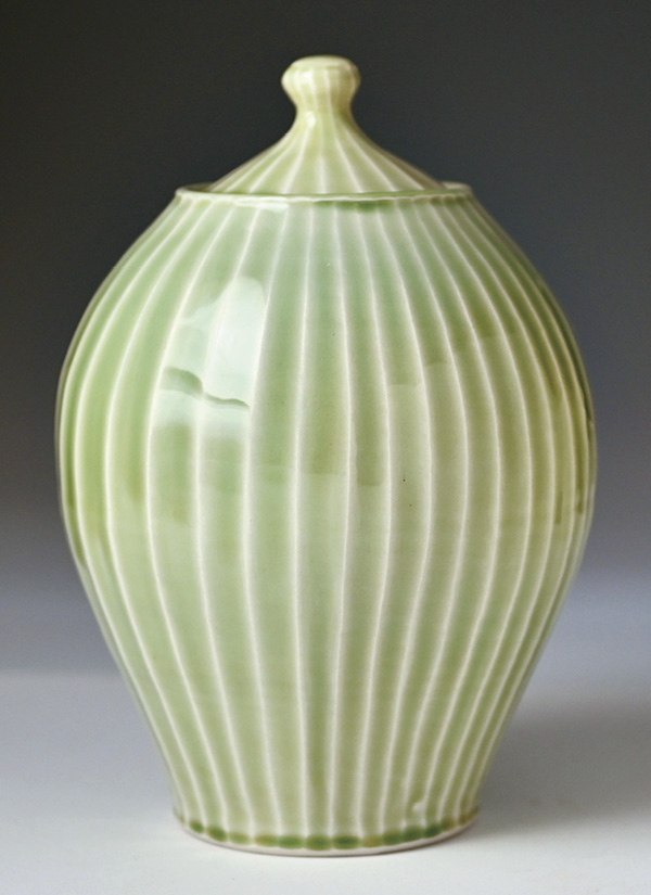 12 Lucy Fagella's Green Ripples Large Urn, wheel-thrown and carved porcelain, fired and slow cooled in oxidation to cone 6.