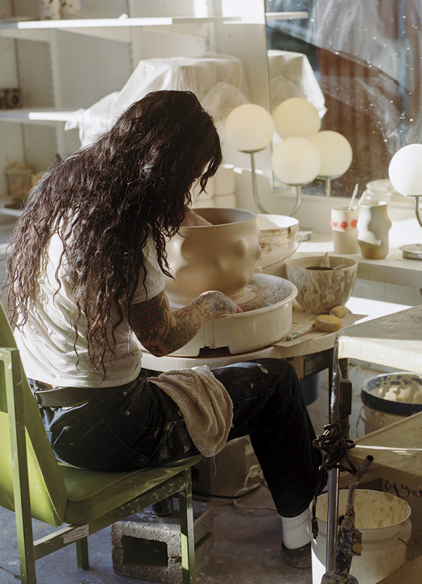 3 Wheeler throwing a large Lump planter in her garage studio. Photo: Kris Hayden (@parallelparking).
