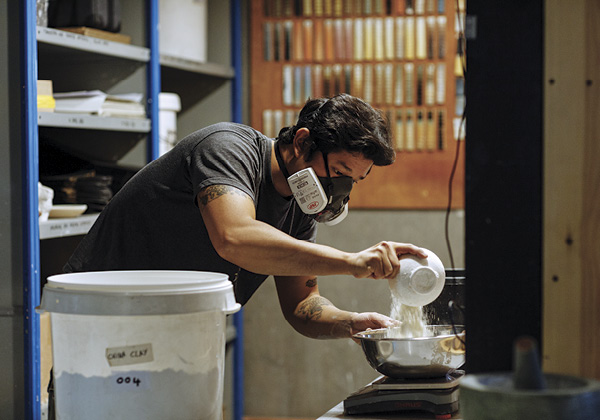 5 Rhee weighing raw glaze materials.
