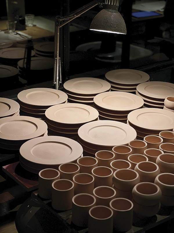 9 Stacks of bisque-fired wing bowls, mugs, and cortado bowls made for Patina Bakery Café in Edinburgh, Scotland. Photo: Patina.