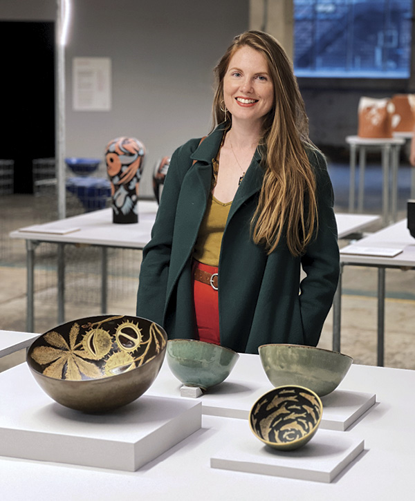 3 Kate Sampson with her work at The British Ceramics Biennial. Photo: William Stone.