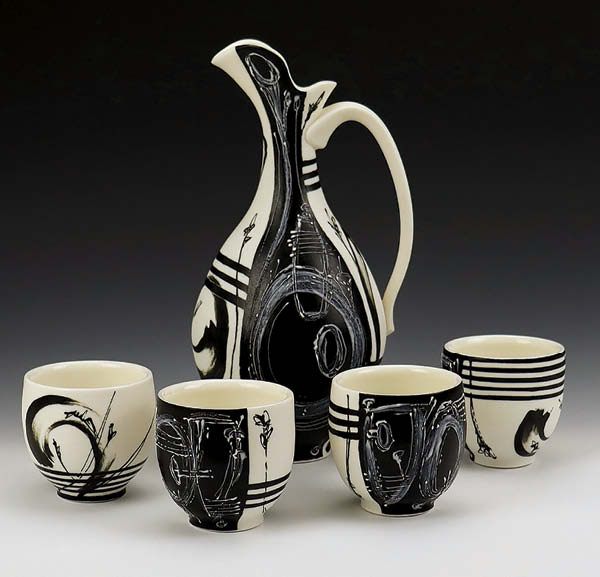 2 Kelly Stevenson’s pitcher and cups (set of 4), to 11 in. (28 cm) in height, porcelain, slip, glaze. 2023.