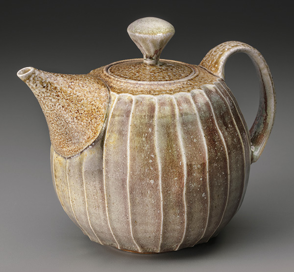 7 Faceted teapot, 8 in. (20 cm) in width, white stoneware, copper glaze, salt glazed and wood fired to cone 10, 2021. Photo: John Polak.