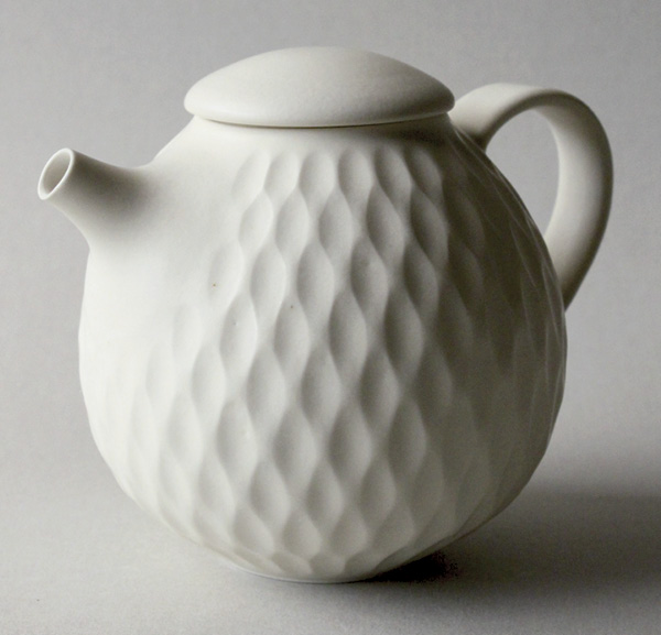 9 Cream-white carved lattice-pattern teapot, white stoneware, dolomite glaze, 2022.