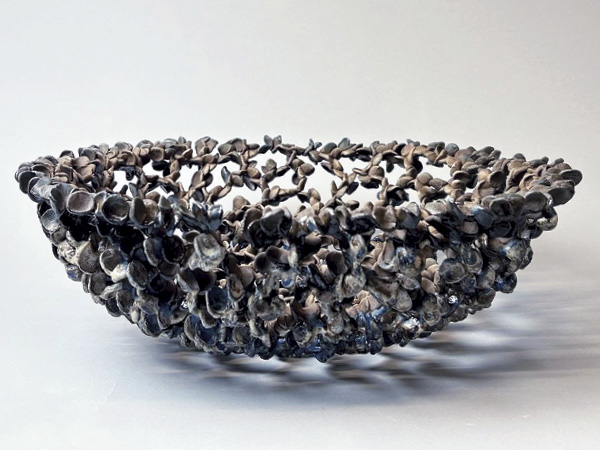 1 Minah Kim’s Sokuri (Basket of May 1980), 16 in. (41 cm) in diameter, porcelain, glaze, 2023.