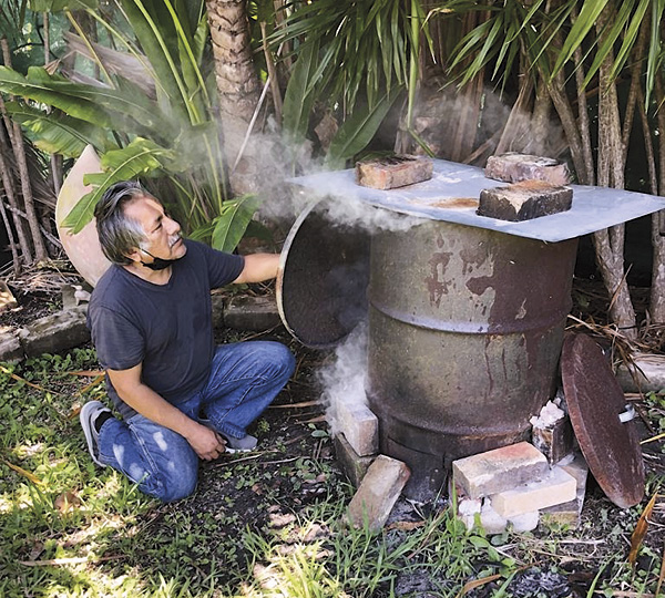 6 Ramírez smoking pots in a metal drum, 2020.