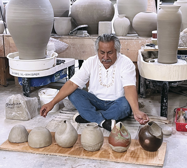 8 Ramírez displaying the sequence to the work, seven days to firing, East Creek Art, 2023. Photo: Stephanie Arnold.