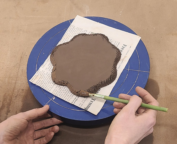 4 Bevel, score, and slip the outer edge of your slab.