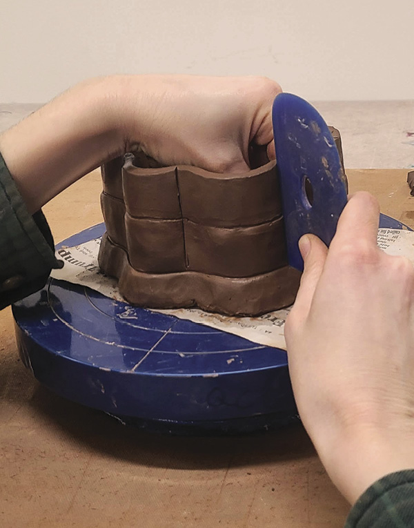 9 After adding the second level, use a rigid rib to exaggerate the shape.