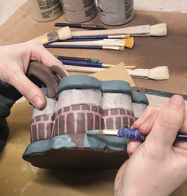 14 Brush prepared terra sigillata onto the hard-leather-hard surface.