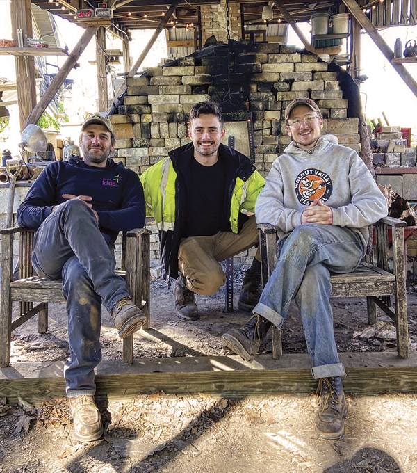 5 Jesse Woodworth, Alex Paat, and Nathan Pauls during the final shift of the final firing in April 2024. Photo: Justin Rothshank.