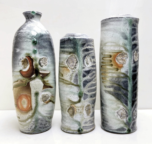 9 Justin Rothshank's porcelain bottles, to 12 in. (30.5 cm) in height. Fired for 95 hours with local hardwoods in the final firing, April 2024. Photo: Justin Rothshank.