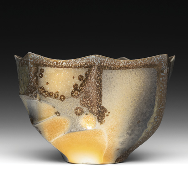 2 Teabowl, 5¼ in. (13.3 cm) in width, wheel-thrown and altered porcelain, shino liner glaze, wood fired in reduction to cone 11, 2023.