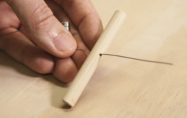 5 Insert approximately 2 inches (5 cm) of wire into the dowel.