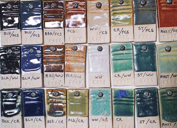 2 Studio glaze test tiles hang together on the wall.