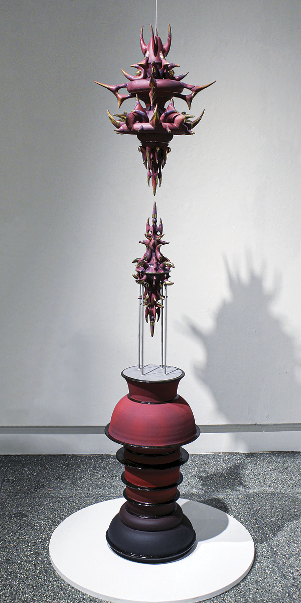 1 Brady Fanning's Vicious Fixation, 7 ft. 2 in. (2.2 m) in height, slip-cast and handbuilt white stoneware, Amaco underglaze, gloss glaze, fired in oxidation to cone 6, gold luster, tape, 2025.