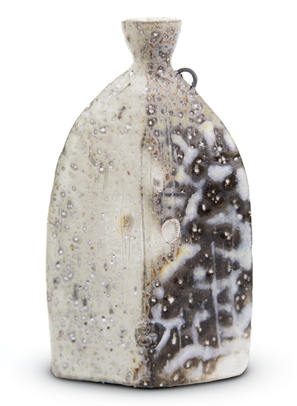 1 Cruz Quintero's Faceted bottle, 6 in. (15.2 cm) in height. Ceramic, fired to cone 10 in a soda kiln.