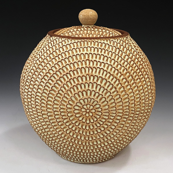 1 Matt Hiller's Sunburst Jar, 8½ in. (21.6 cm) in height, wheel-thrown and carved red stoneware, glaze, fired to cone 5, 2025.